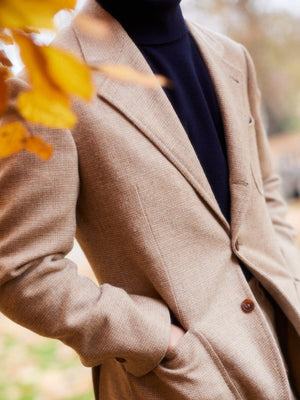 Buzz Tang, co-founder of The Anthology, in a light brown coat interview with A Collected Man London