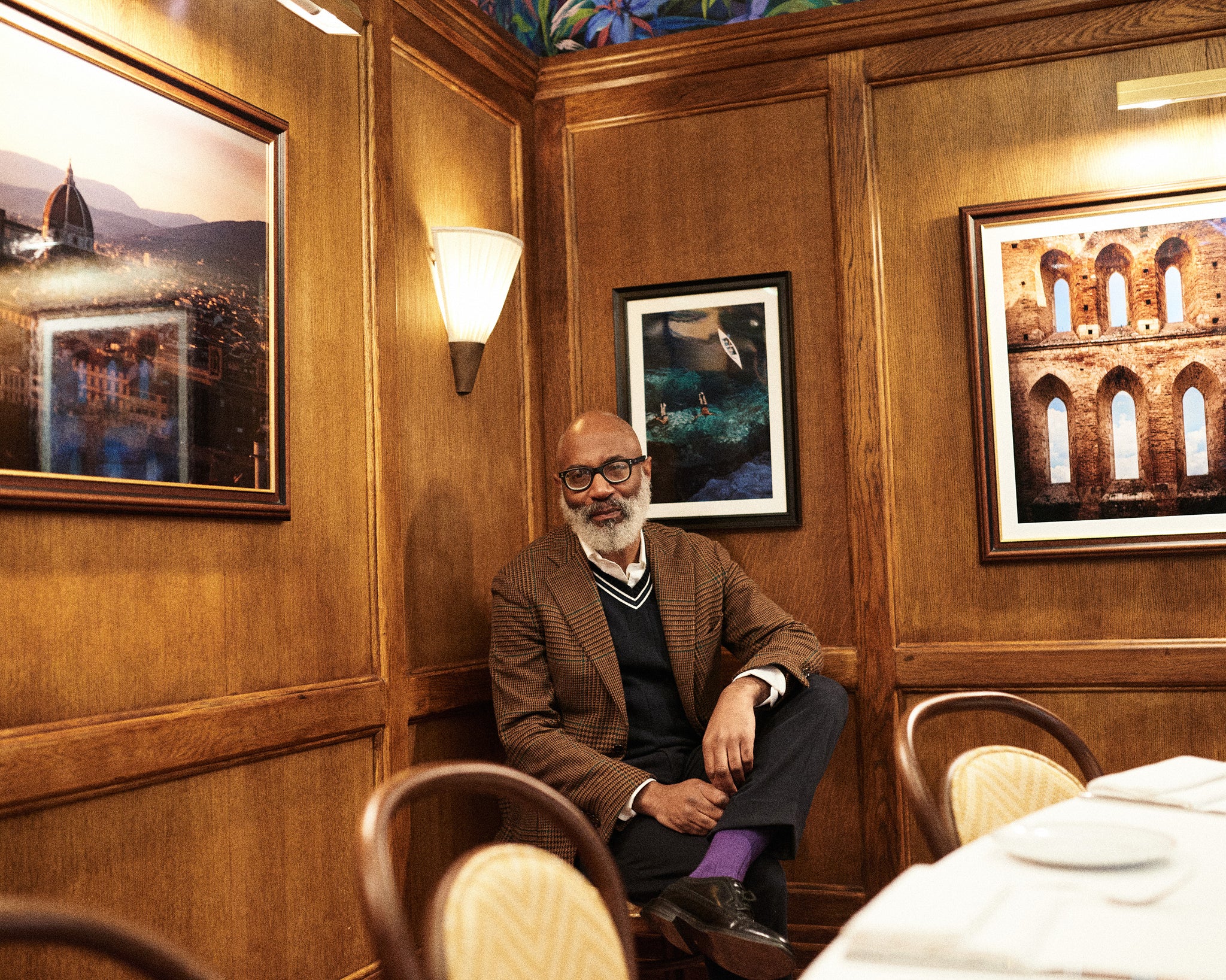 Jason Jules in a wood-panelled room. Jason Jules against a dark background, discussing Ivy Style and his interest in African American fashion. Read the interview at A Collected Man London.