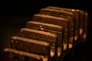 The teeth of a stylised metal wheel