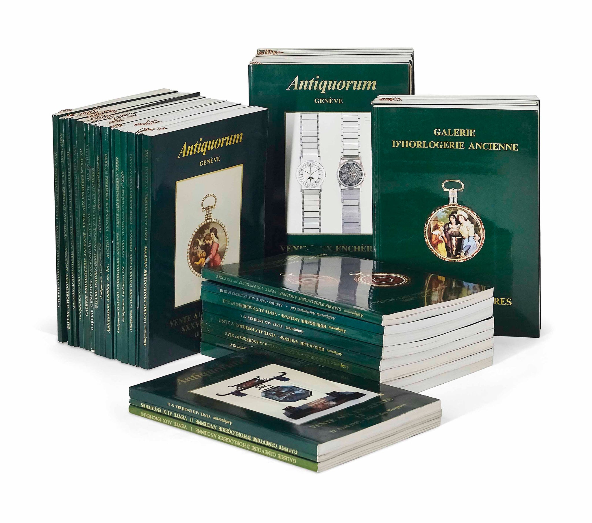 Watch auction catalogues from Antiquorum auction house, in dark green books that are stacked, article at A Collected Man London