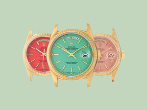 A row of Rolex Stella dials in red, green, and light pink